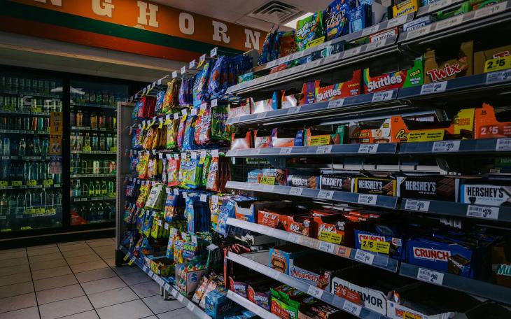 Candy bars and other sweets are displayed in the candy aisle of a convenience store in Austin on March 11, 2026. Beginning April 1, people will not be allowed to purchase candy and certain sweetened beverages using SNAP benefits.