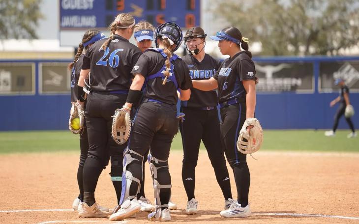 The Angelo State softball team meets at the pitcher's circle during the 2026 season.