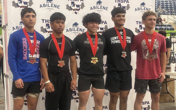Ballinger’s Treyven Lopez (second from left) took third place in the 132-pound class Friday at the Division IV state powerlifting meet at the Taylor County Expo Center in Abilene.