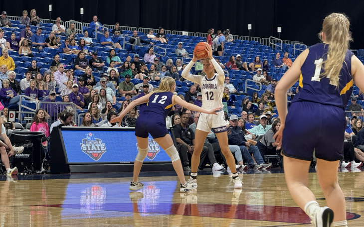Mason's Flora Appleton looks for room against the defense of Panhandle's Addison McCoid in the state final Thursday, March 5, 2026.