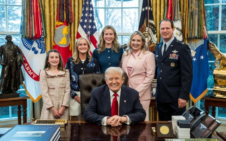 August Pfluger poses with his family and President Donald Trump on March 6, 2026, after his retirement from the U.S. Air Force.