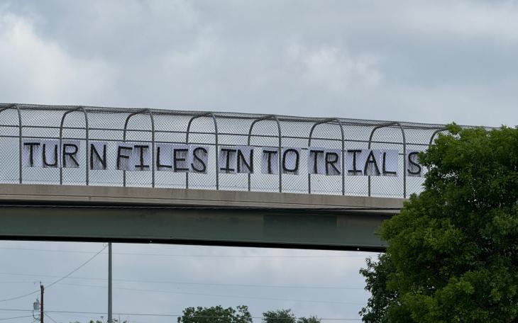 A group of liberal protestors received attention Wednesday evening in San Angelo by placing signs above South Bryant Boulevard.