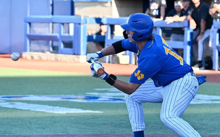 Angelo State's Hunter Holt lays down a bunt during the 2026 season against West Texas A&amp;M.
