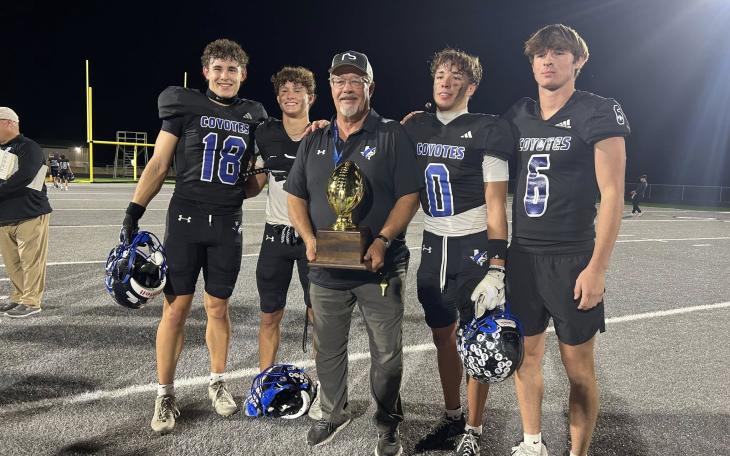 Head coach Harley Ethridge celebrates with Richland Springs after a playoff win during the 2025 football season.