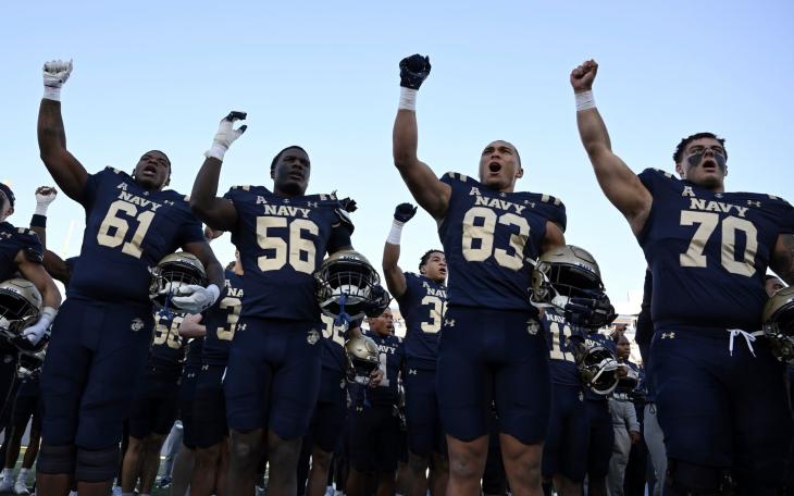 The Navy football team celebrates a win during the 2025 season.