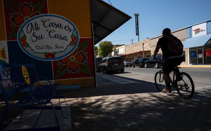 A cyclist rides their bike through downtown Del Rio on Aug. 21, 2024.