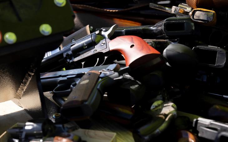San Antonio police officers collect firearms and ammunition during a gun buyback event at the Alamodome on Nov. 24, 2024.