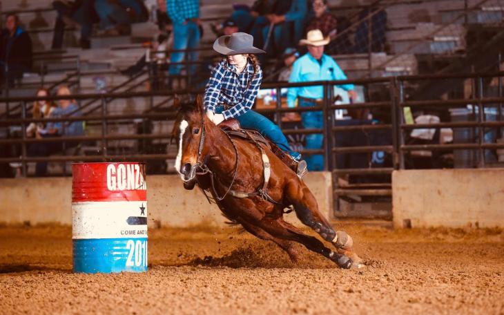 A barrel racer competes in the Texas High School Rodeo Association State Finals in 2025.