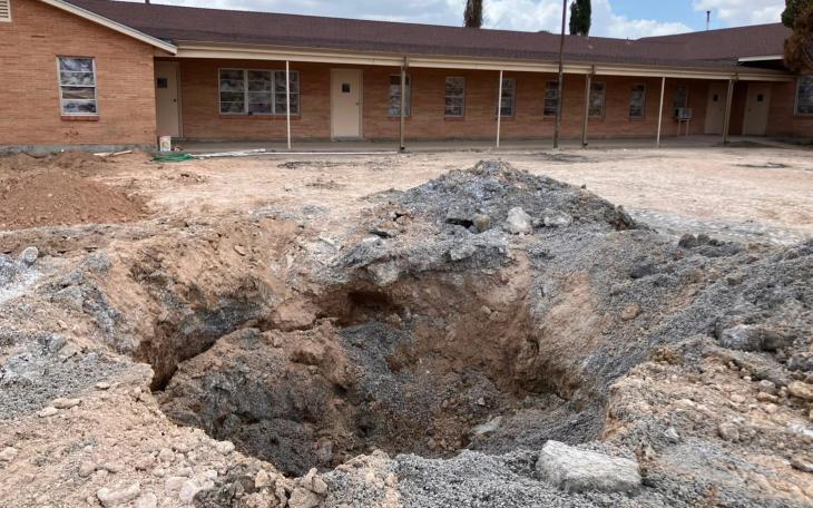A pit in the parking lot of the First Baptist Church in Grandfalls, where the Railroad Commission plugged a wellbore that had gushed thousands of gallons of wastewater. Grandfalls is southwest of Odessa, between Monahans and Fort Stockton.
