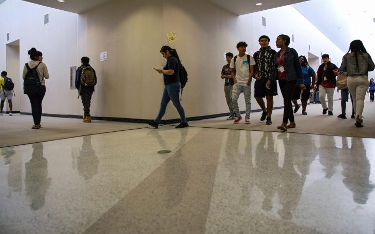 High school students walk to an after-school science tutorial that provides additional support for students taking the STAAR test at Elsik 9th Grade Center on April 19, 2018