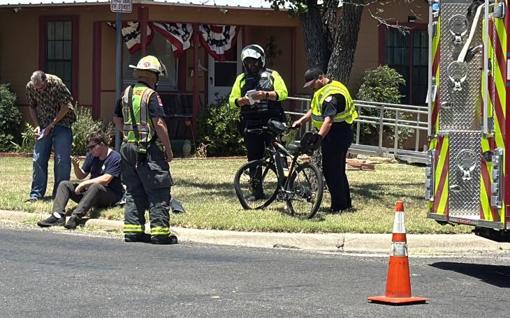 A man crashed his bicycle into a moving vehicle Monday afternoon after running a stop sign.
