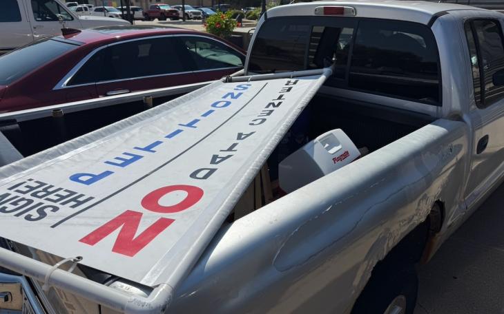 A sign advertising the recall petition of Mayor Tom Thompson in the back of Richard Summers' rusty, old Dodge pickup. He drove to city hall to deliver only 2/3s the petitions required to recall Mayor Tom Thompson.