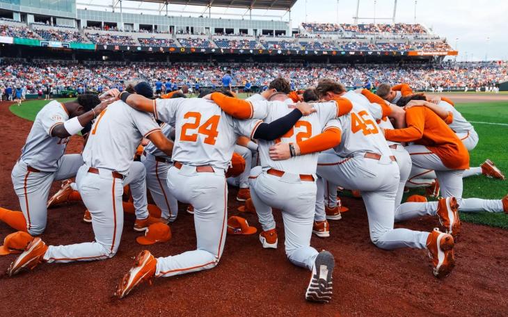 The Texas Longhorns huddle at the 2026 College World Series