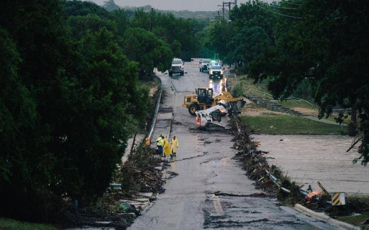 First responders on a bridge covered by water after the flood in Kerrville on July 16, 2026.