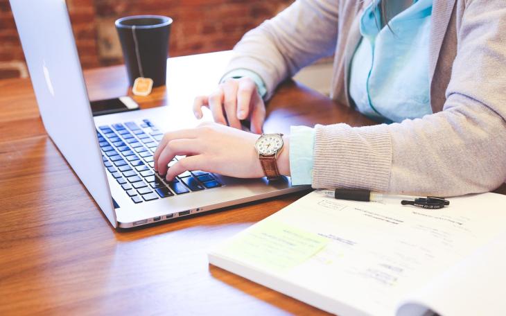 A woman working on her laptop computer.