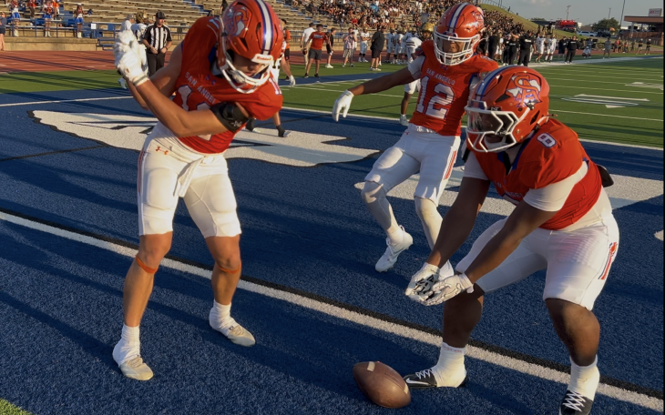 Central's Tucker Beaty does a golf celebration while Ellis Johnson (12) and Zey Johnson (8) look on after a touchdown against Abilene High on Friday, Aug. 28, 2026, at San Angelo Stadium.