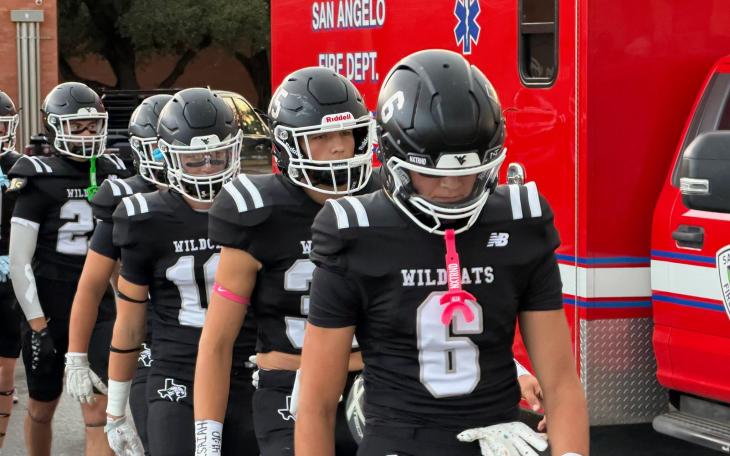 Water Valley football players, led by Branson Lacy (6) walk onto the field before their game against Rankin on Friday, Sept. 4, 2026.