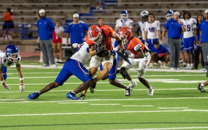 San Angelo Central's Gavin Johnson makes a catch in traffic against Abilene Cooper on Friday, Sept. 11, 2026.