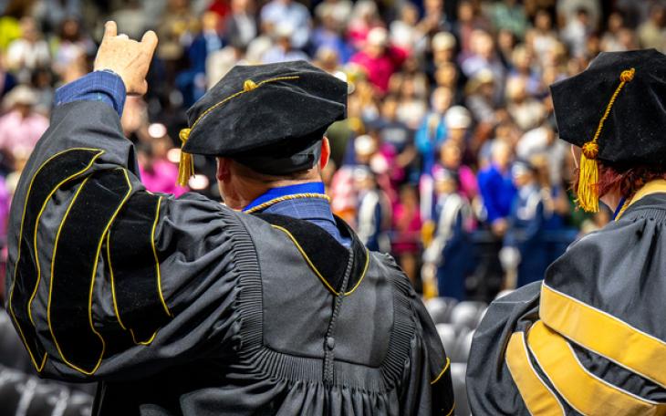 ASU’s first Psy.D. graduates, Drs. Lee Floyd and Kate Vick, acknowledge the audience at spring 2026 commencement.
