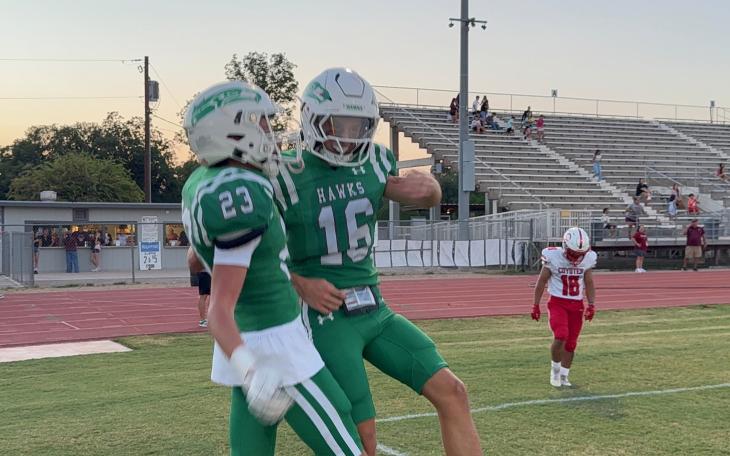 Wall's Sutton Robertson (23) and Nolan Whigham (16) celebrate after a touchdown against La Joya on Thursday, Sept. 3, 2026.