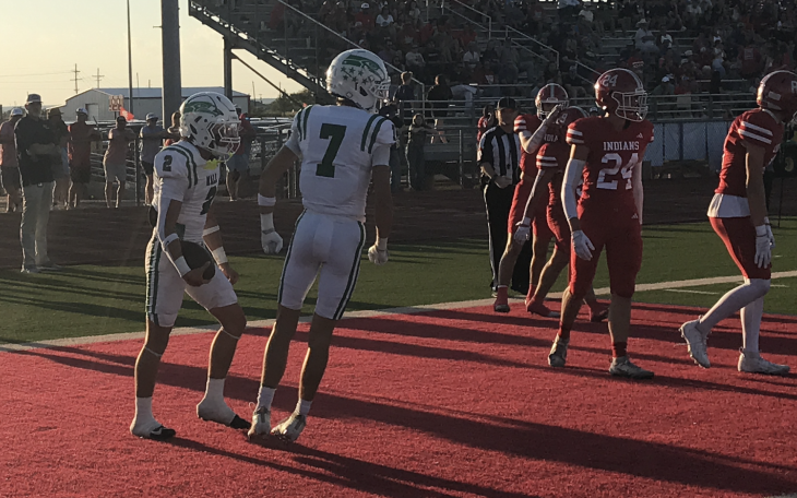 Wall's Gunner Garza (2) celebrates with Braylon Nelson (7) after Garza's touchdown run against Jim Ned on Friday, Sept. 11, 2026.