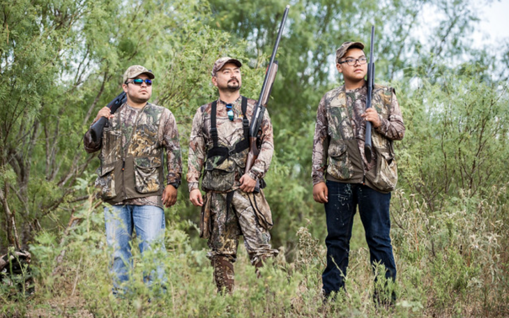 Three people are shown dove hunting.