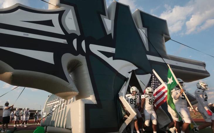 The Waxahachie Indians walk onto the field before a football game during the 2026 season.