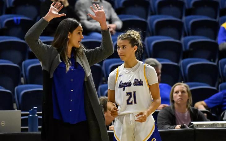 Angelo State women's basketball coach Alesha Ellis talks to Majik Esquivel during the 2025-26 season.