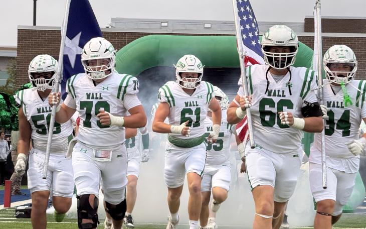 The Wall Hawks run out onto the field on Oct. 2, 2026.