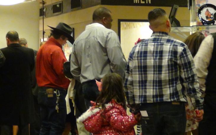 A dad and daughter walk arm in arm (LIVE! photo by Cheyenne Benson)