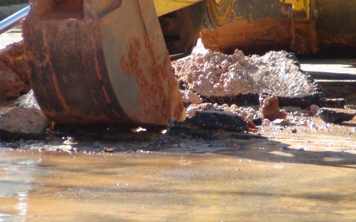 City workers break the asphalt to get to the main (LIVE! photo by Cheyenne Benson)