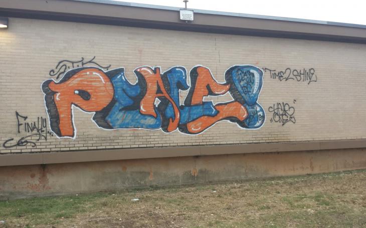 A vandal sending good vibes tagged Central High School with graffiti sometime Thursday night. (LIVE! Photo/John Basquez)