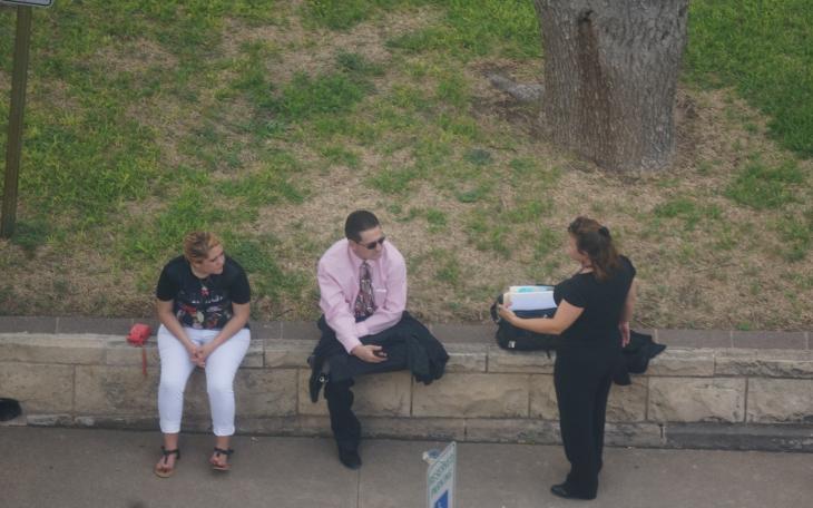 Serrano (center) and his attorney (right) converse outside the courthouse after trial is recessed Tuesday. (LIVE! Photo/Chelsea Schmid)
