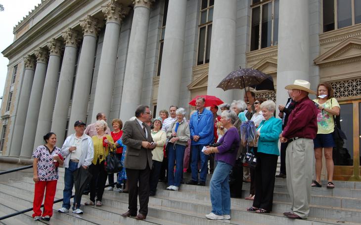 Those gathered at Fairmount Cemetery bow their heads for prayer on Tuesday at the Veterans Day Celebration. (LIVE! Photo by Chelsea Schmid)
