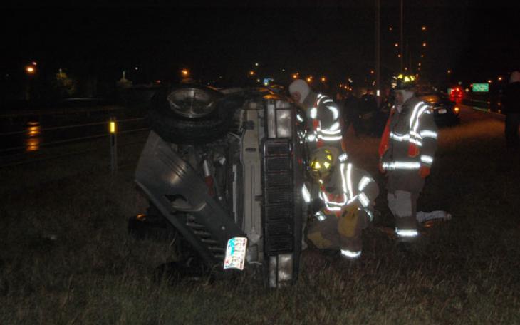 Champagne colored Jeep rolls after losing control on a patch of ice. (LIVE!! Photo by John Basquez)