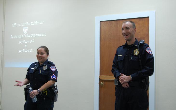 Jennifer Kuhlmann and a fellow officer answer questions at Thursday's crime prevention and identity theft meeting. (LIVE! Photo by Chelsea Schmid)