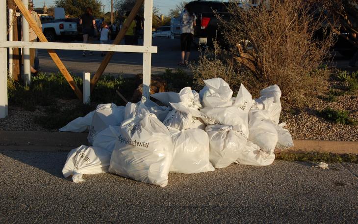 Cub Scout Pack 374 and their parents spent part of yesterday afternoon picking up litter behind Target. (LIVE! Photo/Matt Sage)