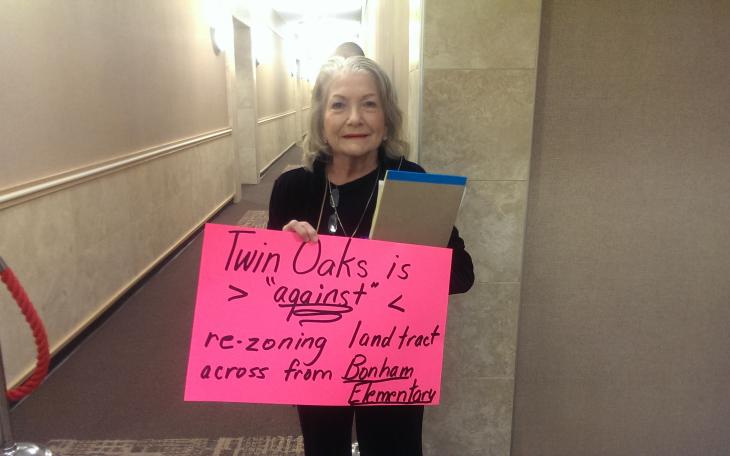 San Angelo resident Linda Silva sums up public sentiment with her sign against the zone change at the last City Council meeting. (LIVE! Photo by Chelsea Schmid)