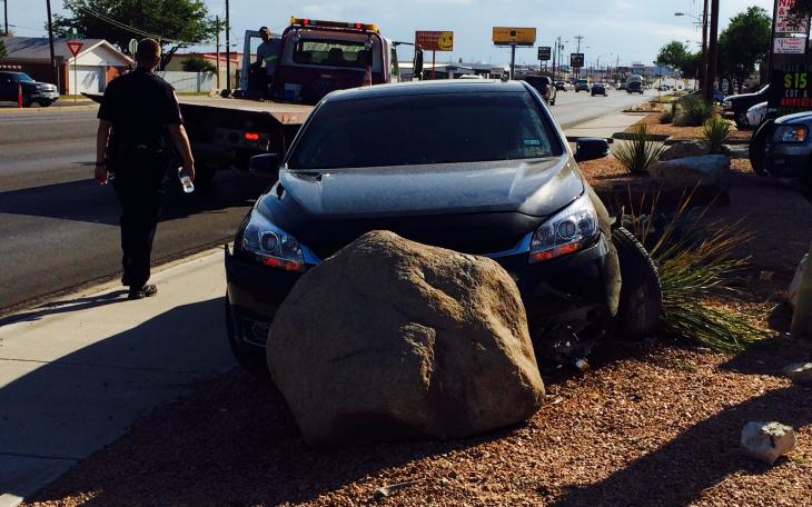 Police said the driver was drunk when he rearranged Fashion Cleaners' Xeriscaped lawn. (LIVE! Photo/John Basquez)