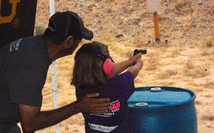 Ann Marie learns how to handle a pistol at the firing range Saturday. (LIVE! Photo/Joe Hyde)