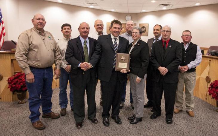 Apache Corporation employees and representatives of the Brazos Valley Groundwater Conservation District pose with the Mayor of College Station, Nancy Berry. (PRNewsFoto/Apache Corporation)