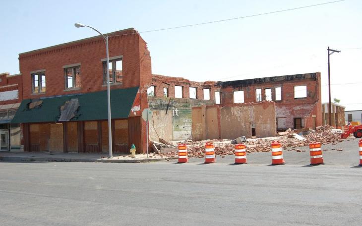 The old boot store at S. Chadbourne and Ave. B that was a burned out hull of an old building experienced a collapse of its south wall. City crews were picking up the bricks and Ave. B was roadblocked Thursday. (LIVE! Photo/Joe Hyde)