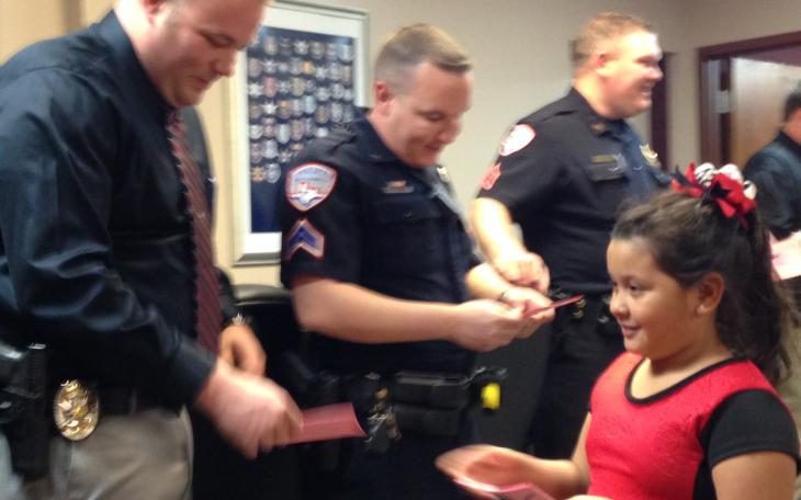 Officers receive hand-made valentines from elementary students. (LIVE! Photo/Chelsea Reinhard)