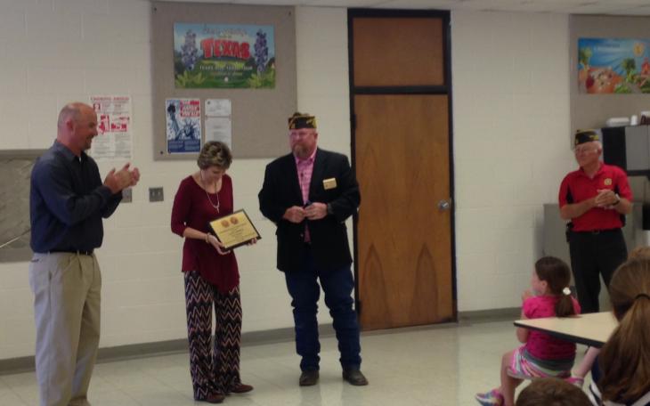 Teacher of the Year Laura Arthur is presented with her award from Wayne McShan. (LIVE! Photo/Chelsea Reinhard)