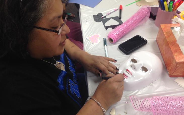 Ruth Ruiz works on a mask that signifies how she felt losing her son, Aaron James Allen,  to a drunk driver. (LIVE! Photo/Chelsea Reinhard)
