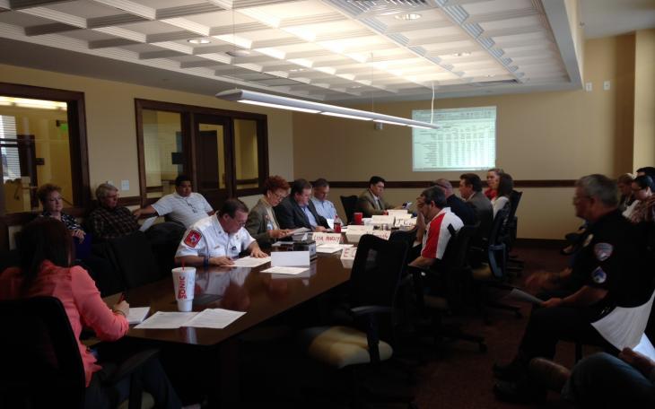 The Meet and Confer team looks over the minutes from a previous meeting. (LIVE! Photo/Chelsea Schmid)