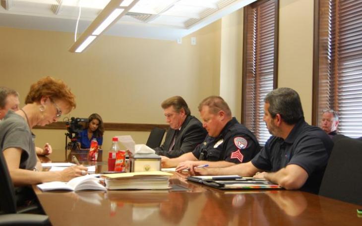 City staff and SACOP look over the minutes of a previous meeting. (LIVE! Photo/Chelsea Schmid)