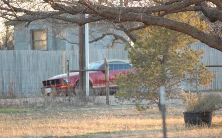 The red Ford Mustang that was abandoned by the male driver. (LIVE! Photo/John Basquez)