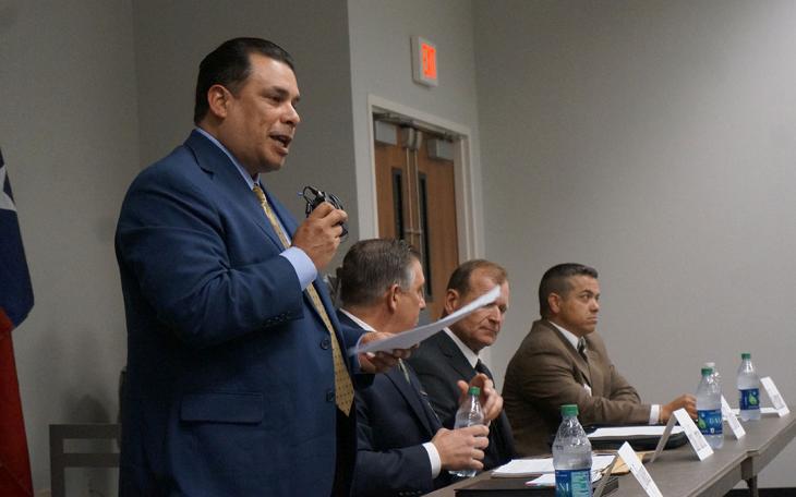 Tim Vasquez (left) speaks at a candidates' forum during his failed re-election bid in 2016