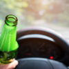 Open Alcohol Container While Driving (Courtesy/freepik)